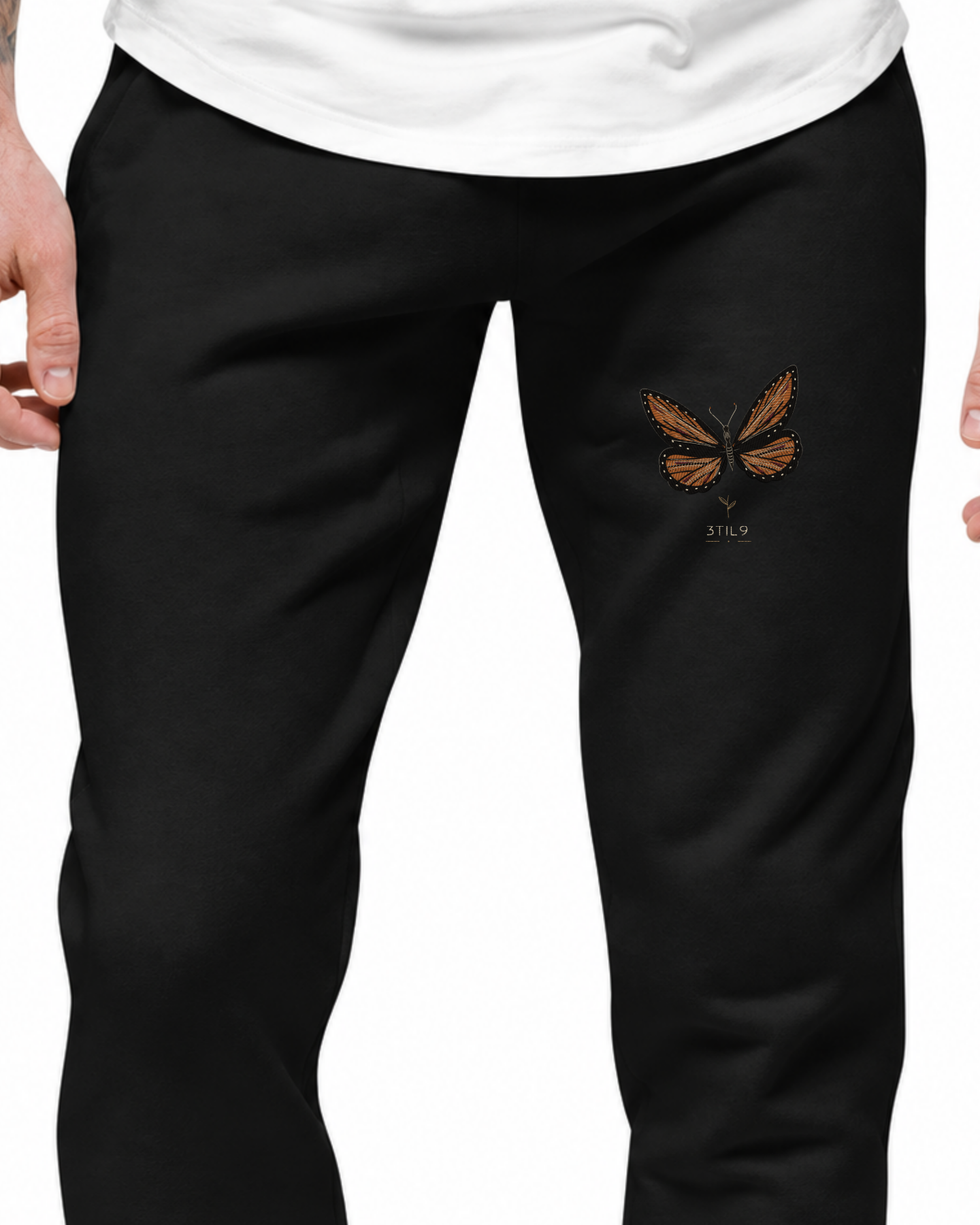 Ember Flight joggers - digital wearing illustration with the original butterfly embroidery artwork