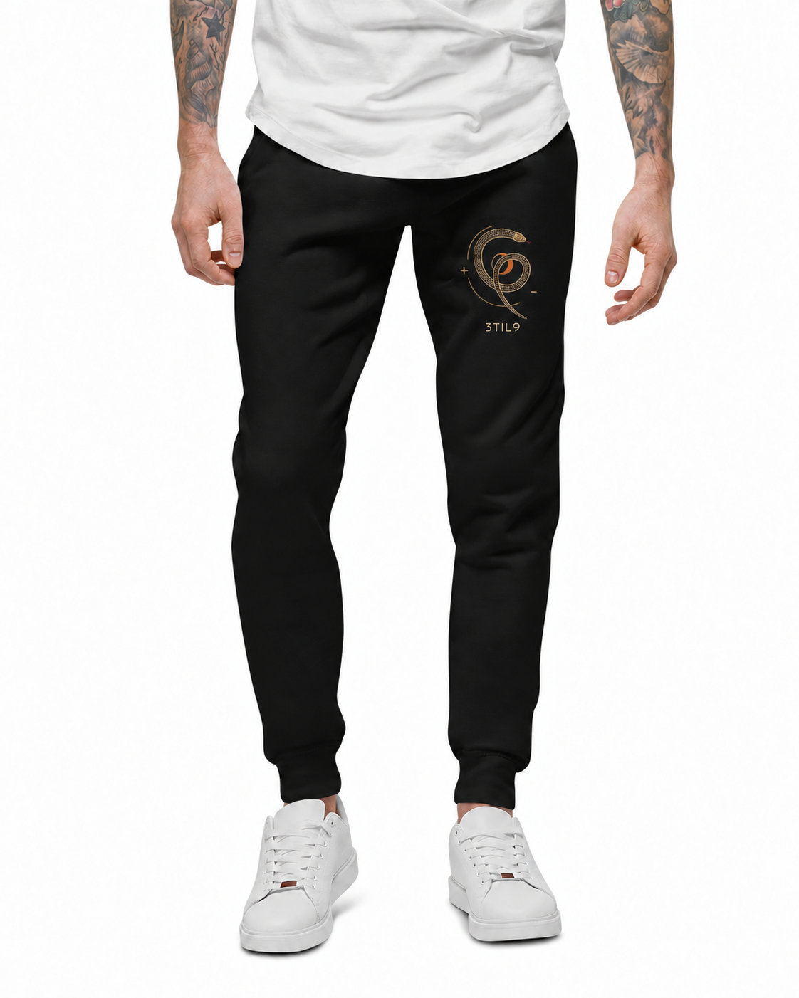 Serpent Orbit Joggers - Black, model view with the selected coil, crescent and separate 3TIL9 embroidery; digital illustration.