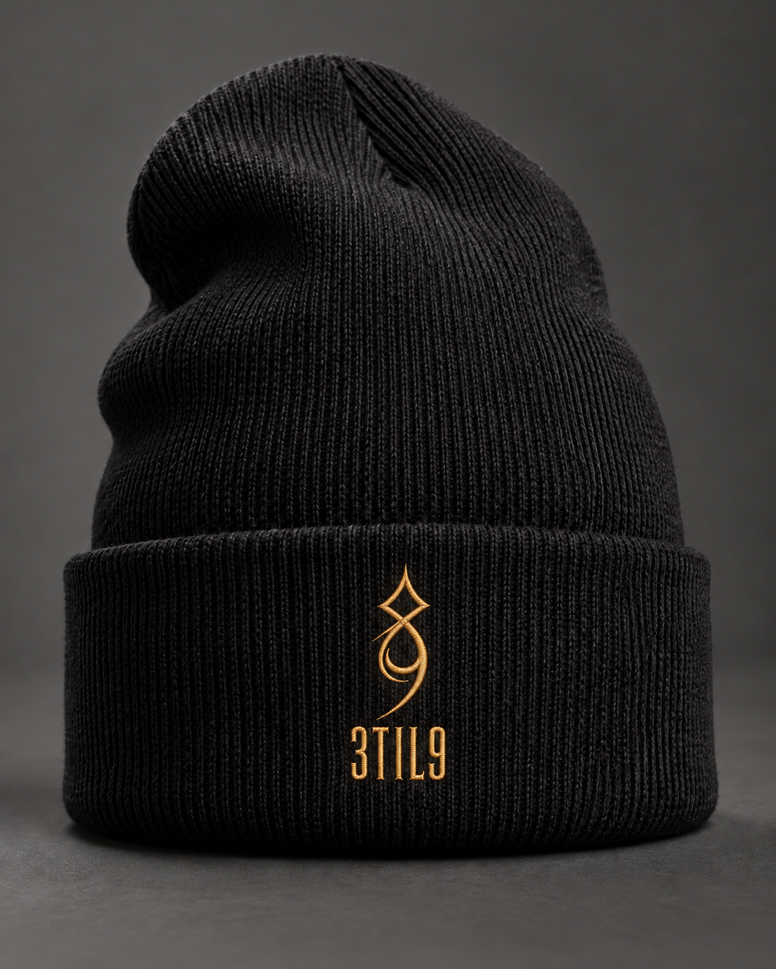3TIL9 Sigil - Black; selected gold embroidery with condensed lettering; digital illustration.
