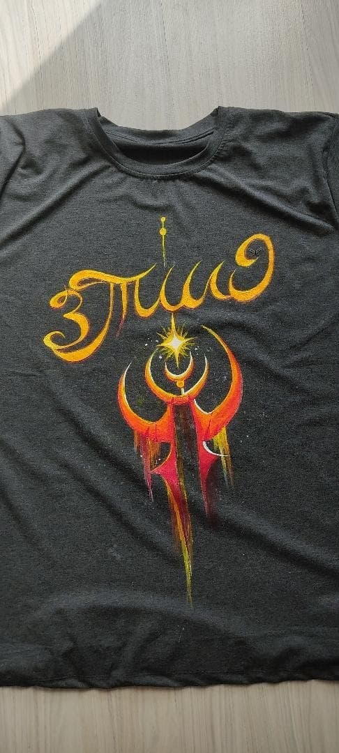 Flame Sigil, the finished brush-painted charcoal tee.